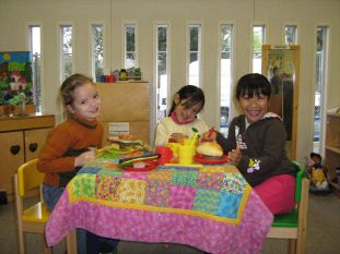3 girls at table